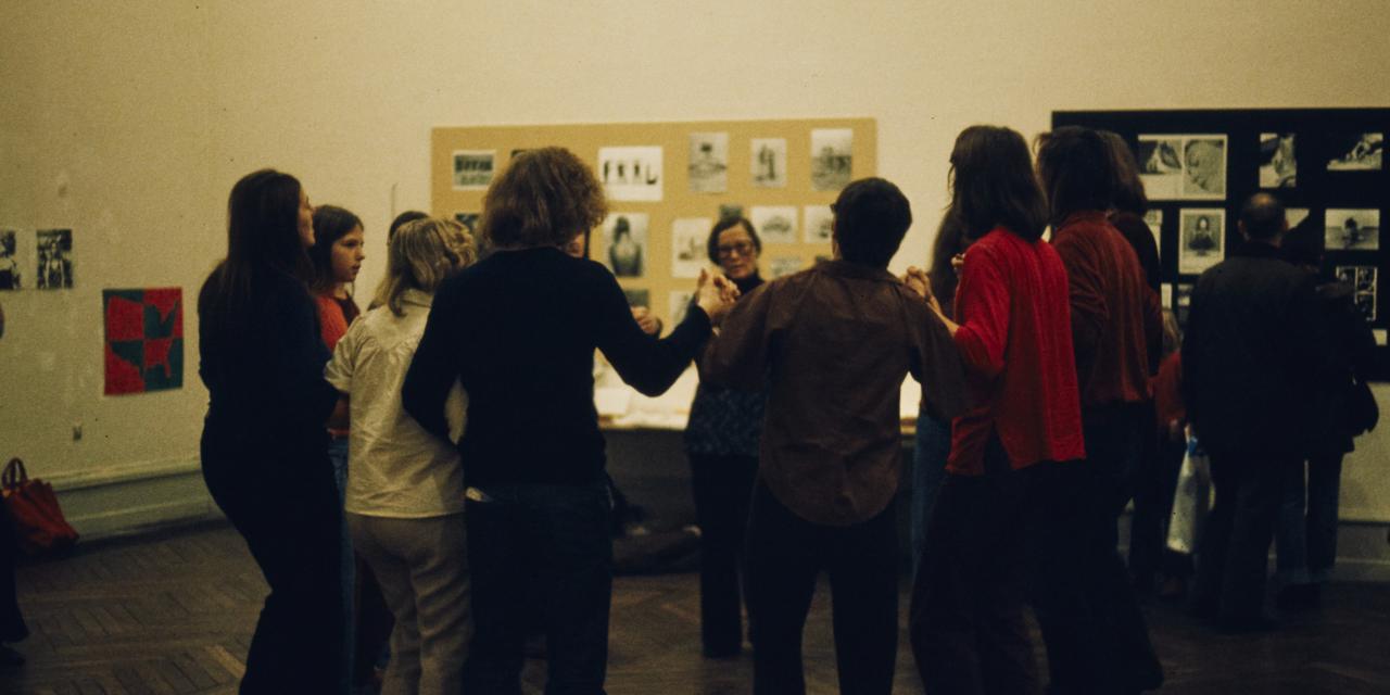 A group of people singing and dancing.