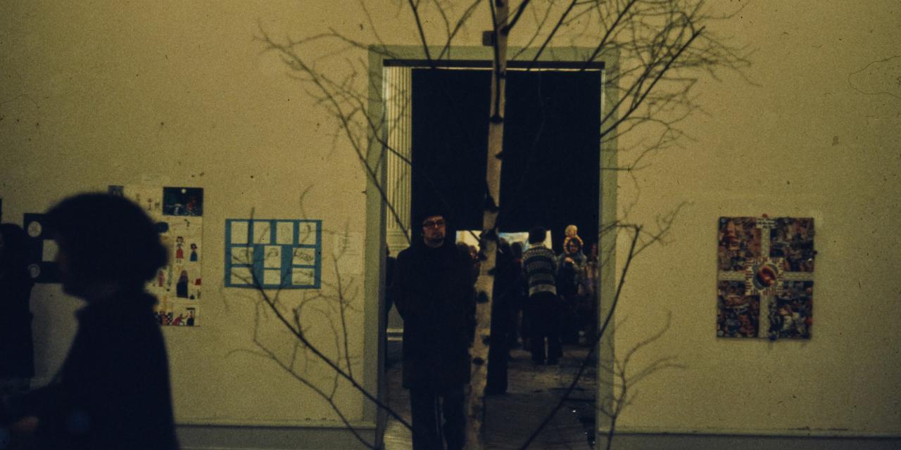 Exhibition room with a tree.