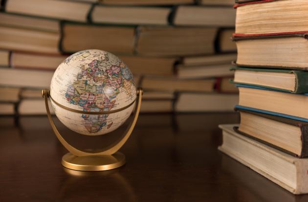 Book stacks and miniature globe