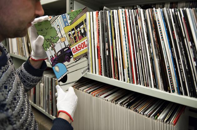 Employee at shelves with LPs