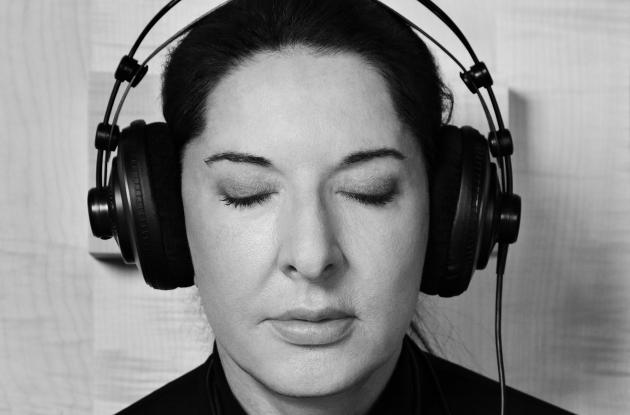 Marina Abramović exhibition photo with headphones