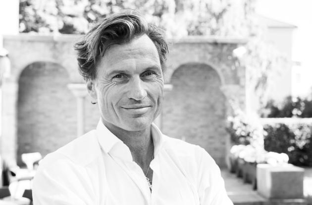 Black and white portrait of billionaire, entrepreneur and author Petter Stordalen