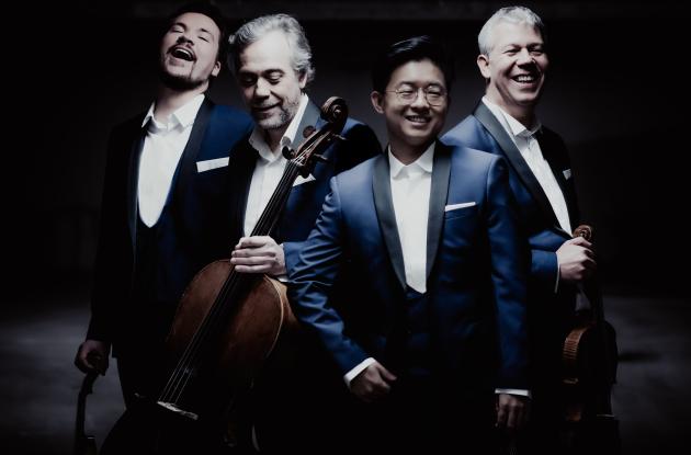 The four members of the Diotima Quartet in blue suits