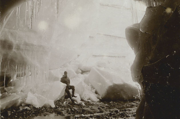 Expedition participant takes a rest in an ice cave