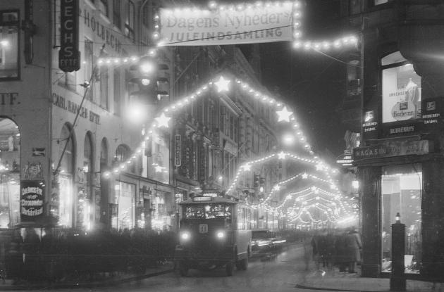 Christmas decorations over Østergade with bus on the road