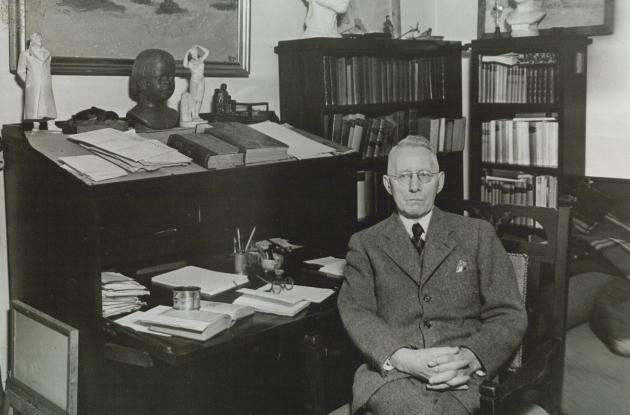 Photograph of Johannes V. Jensen sitting at a desk.