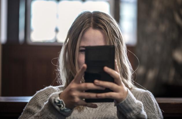 Woman uses smartphone