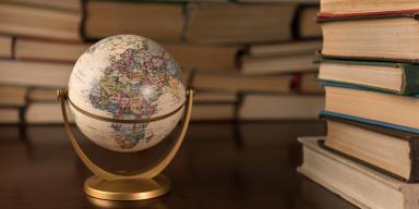 Book stacks and miniature globe
