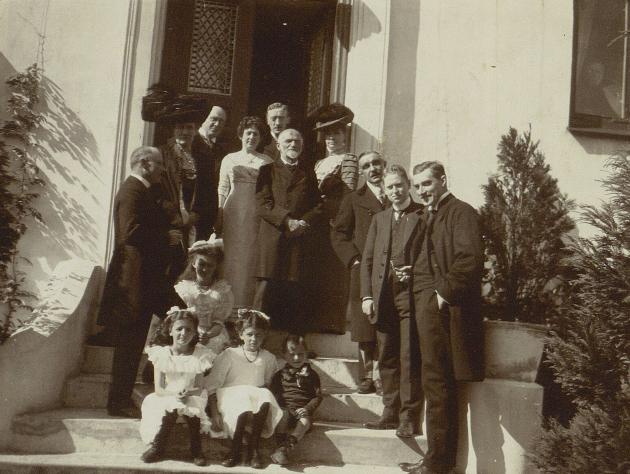 Author Herman Bang on stairs with other artists