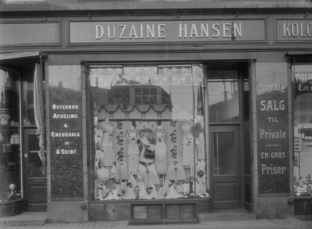 A shop front where you can see a selection of corsets in the window