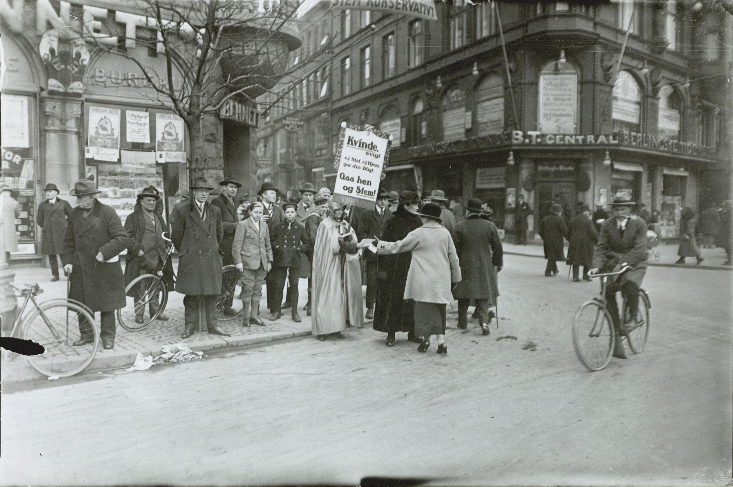 People with placards demonstrate on the street