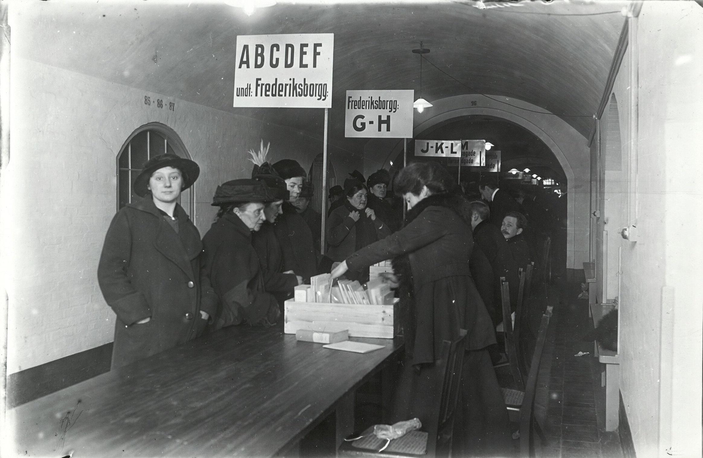 Women attend the polling stations.
