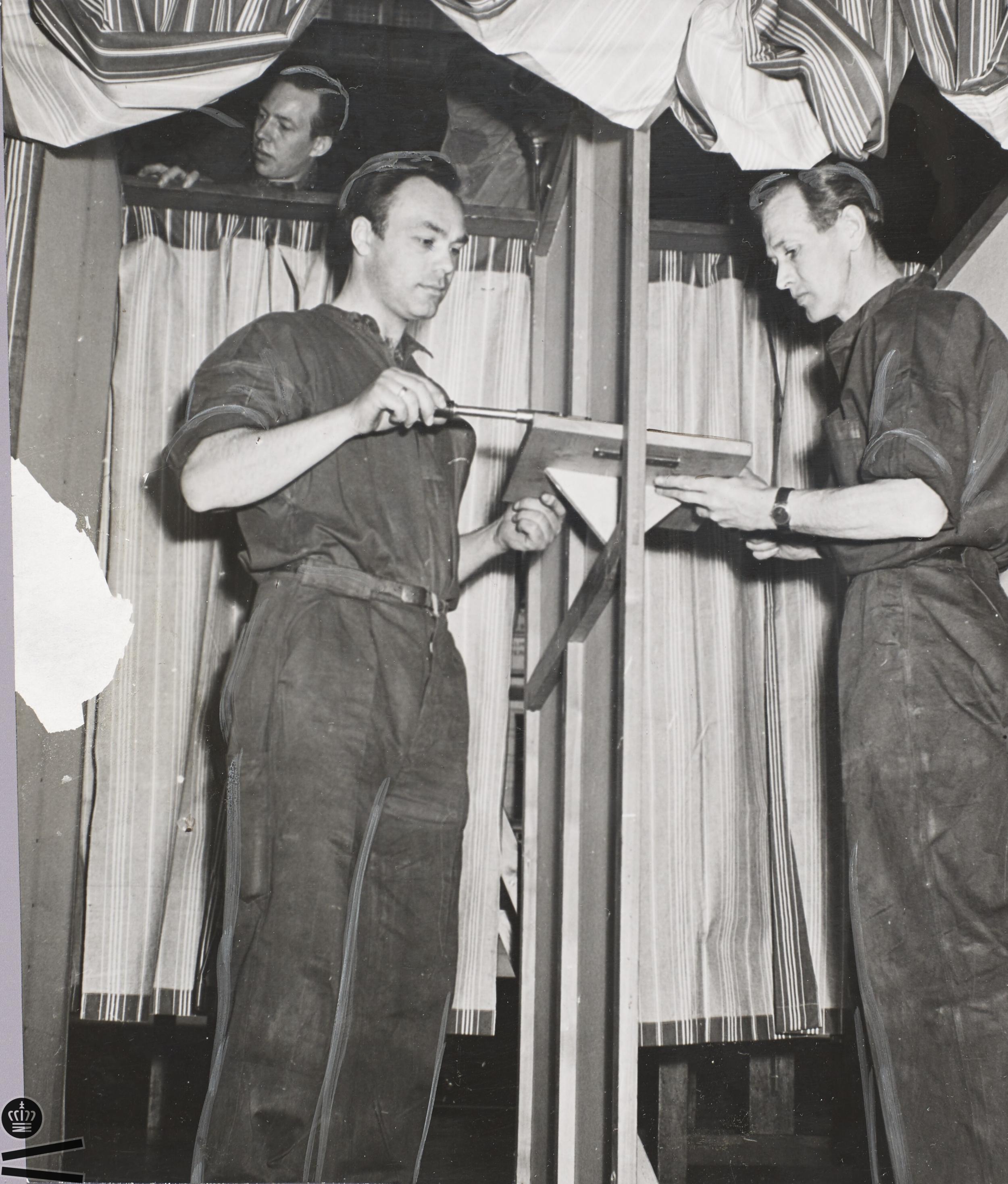 Men set up voting booths