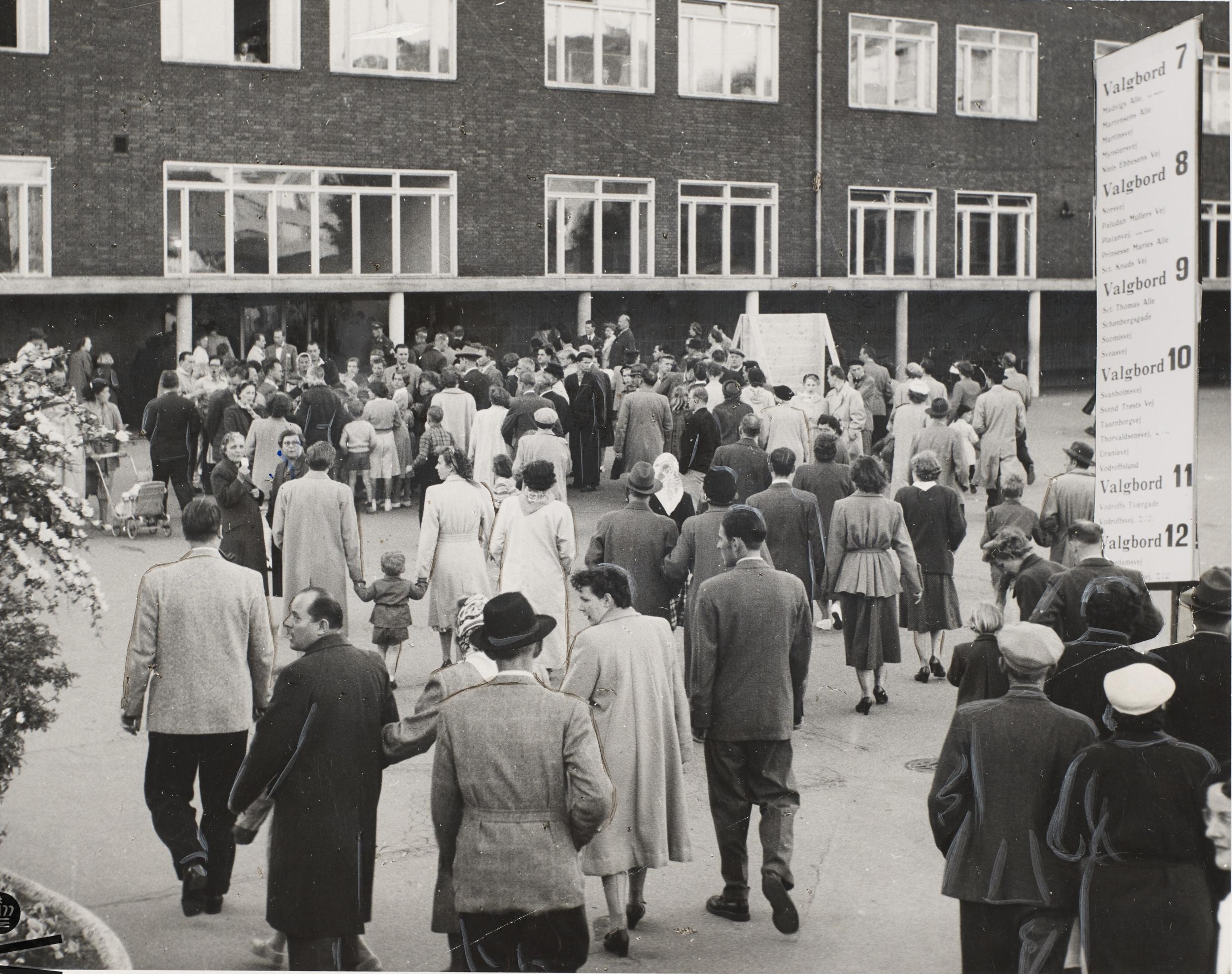 People walk towards polling station