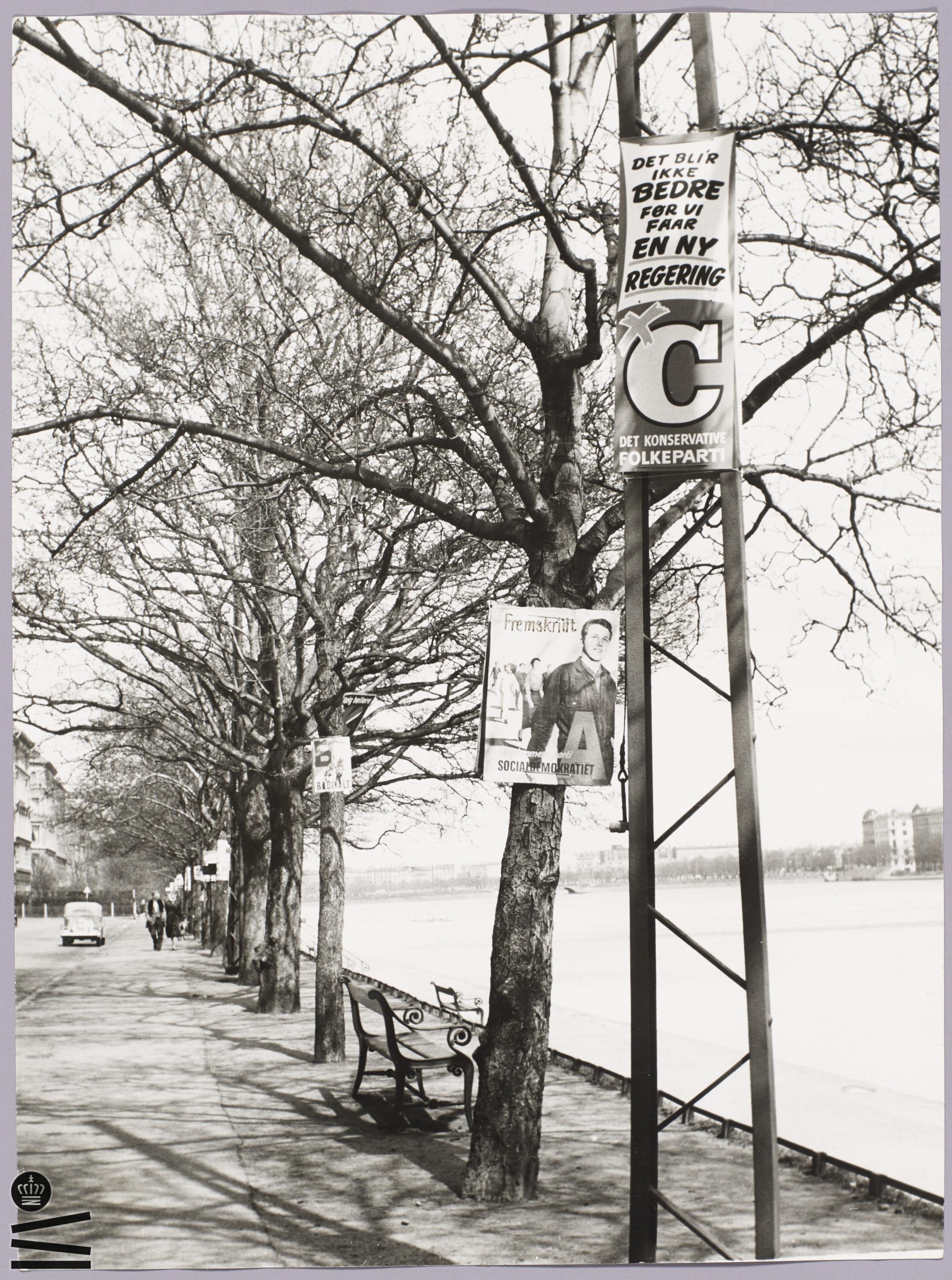 Election posters are hung on poles and trees along the lakes in Copenhagen