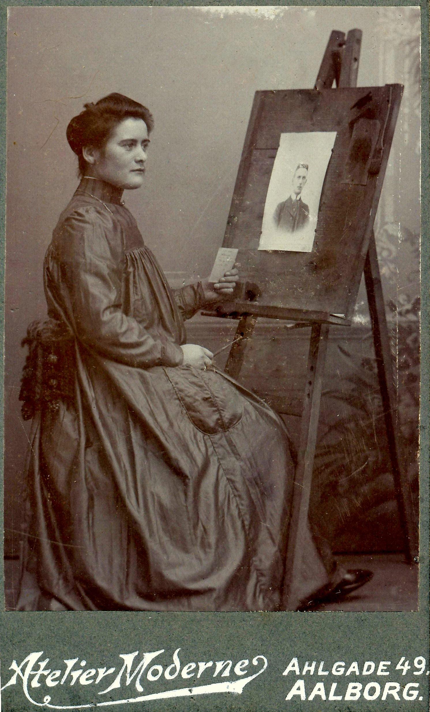 Woman sitting at easel