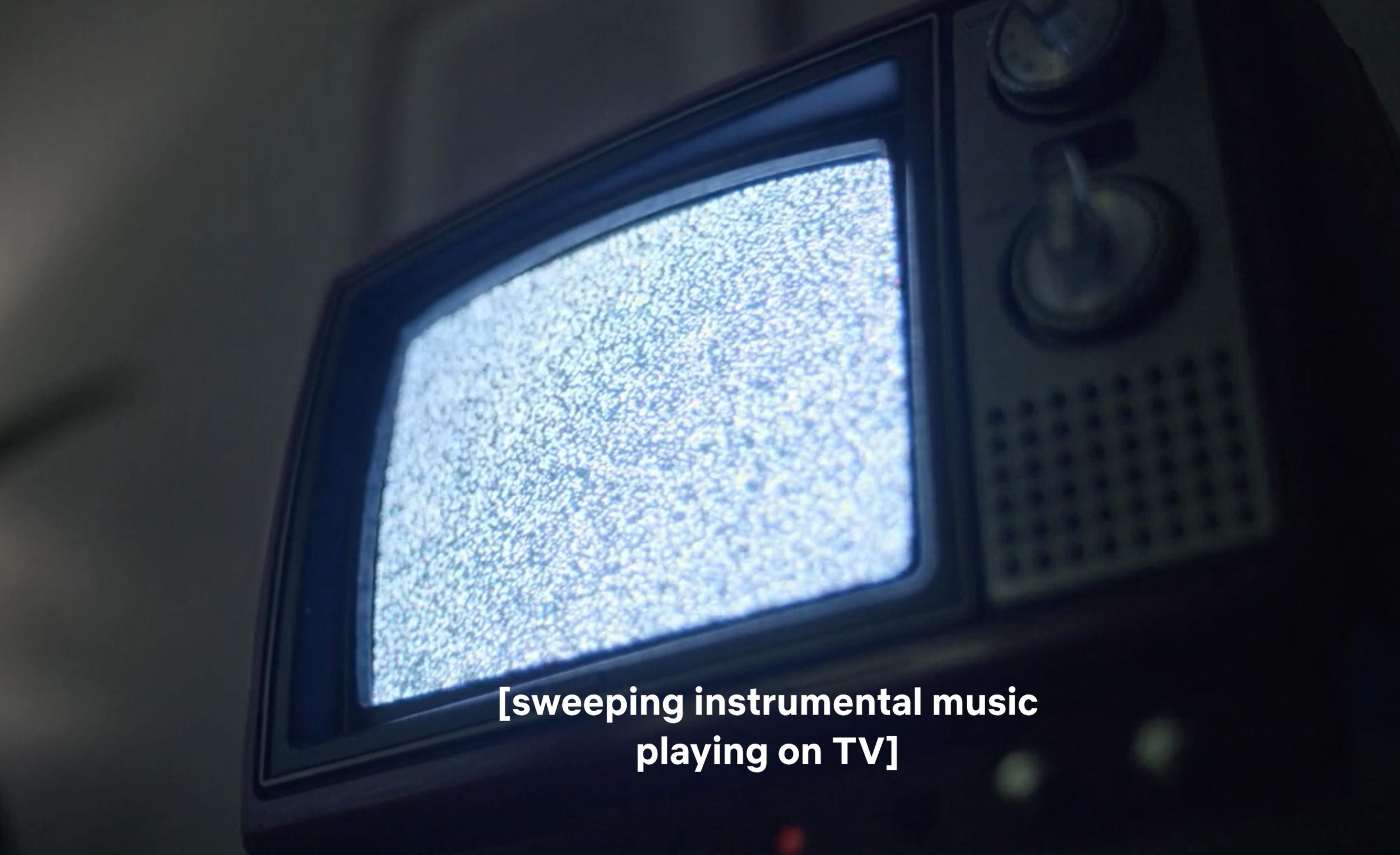 Fra "[Sweeping instrumental music playing on tv]".