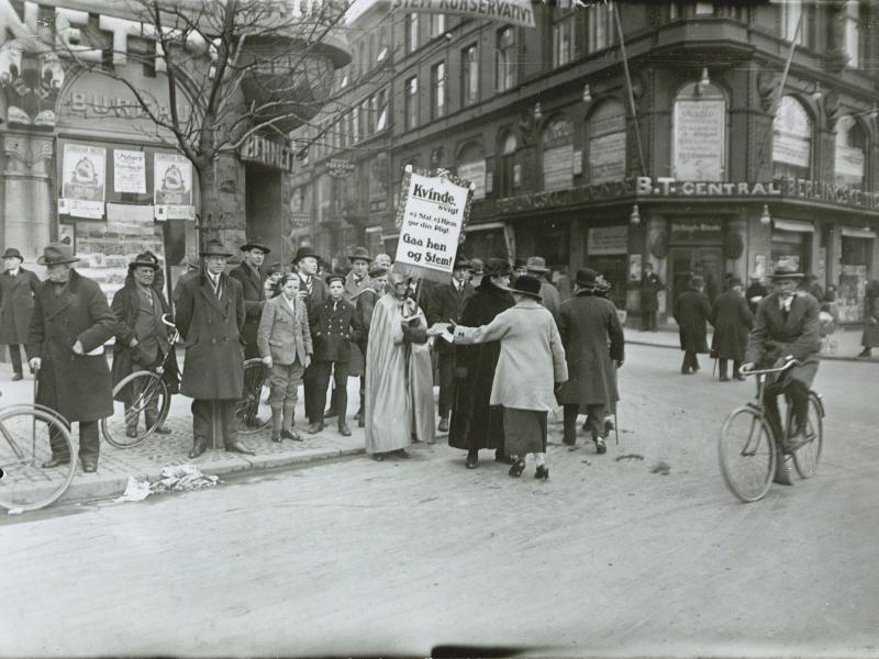 People with placards demonstrate on the street